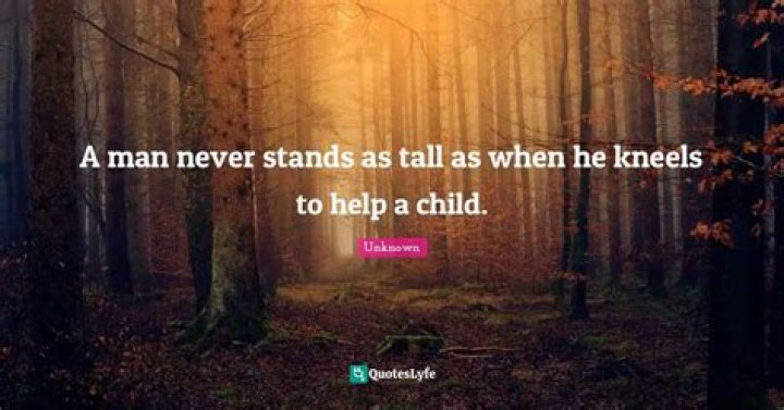 A man never stands as tall as when he kneels to help his child