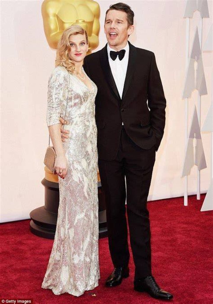 Ethan Hawke plants a smooch on his wife Ryan at the Academy Awards