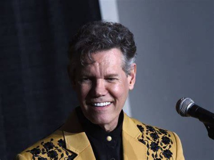 Randy Travis' stagehand 'shot dead by wife' on their porch over