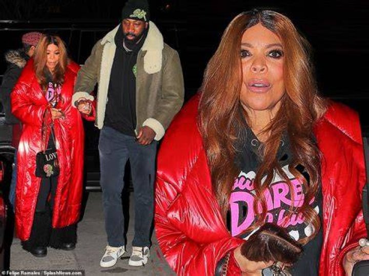 Wendy Williams, 58, holds onto the hand of handsome younger man and